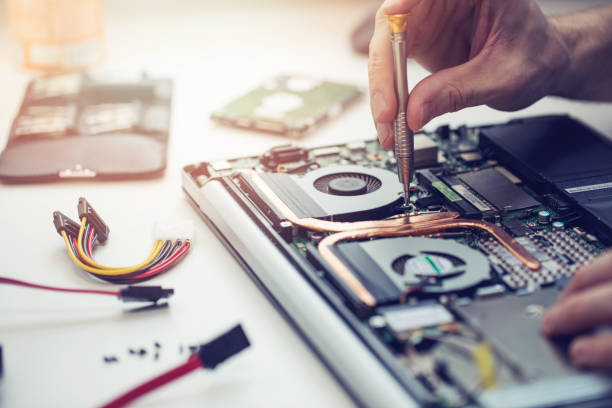 Technician repairing a desktop computer